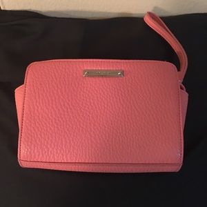 Salmon colored 9 west wristlet
